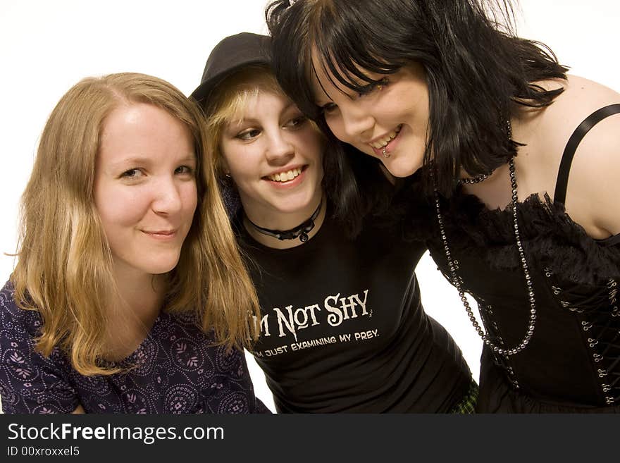 Three happy young girls on white background