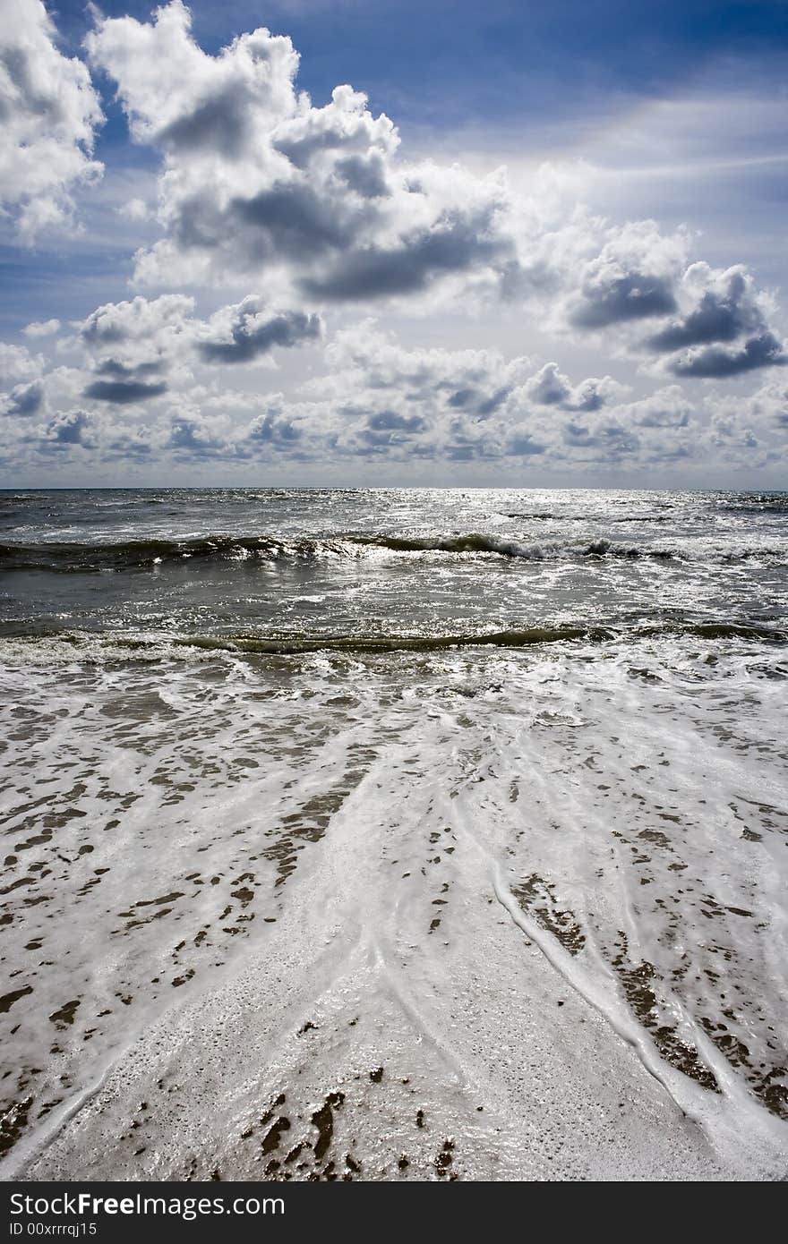 Beach seascape with deep blue sky