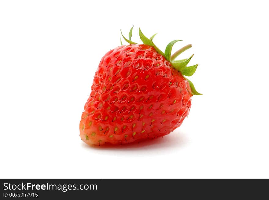 The juicy fresh just washed strawberry on a white background. The juicy fresh just washed strawberry on a white background