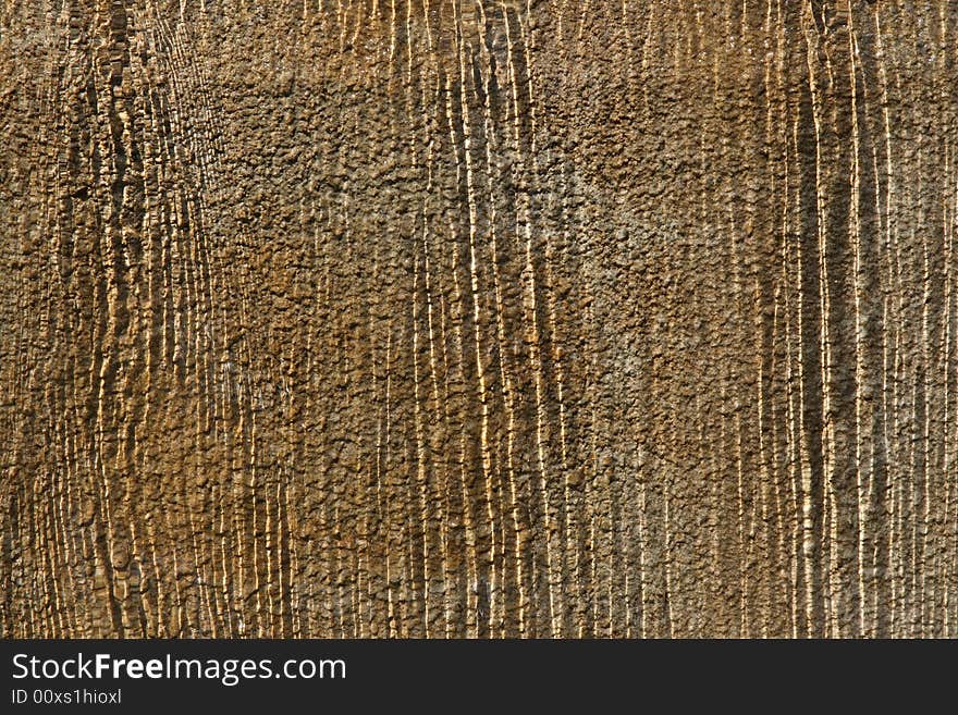 Streams of water running over stone wall