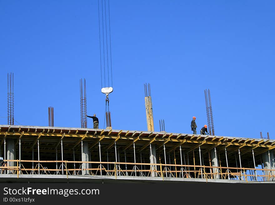 and concretors are working at flat of new building. and concretors are working at flat of new building