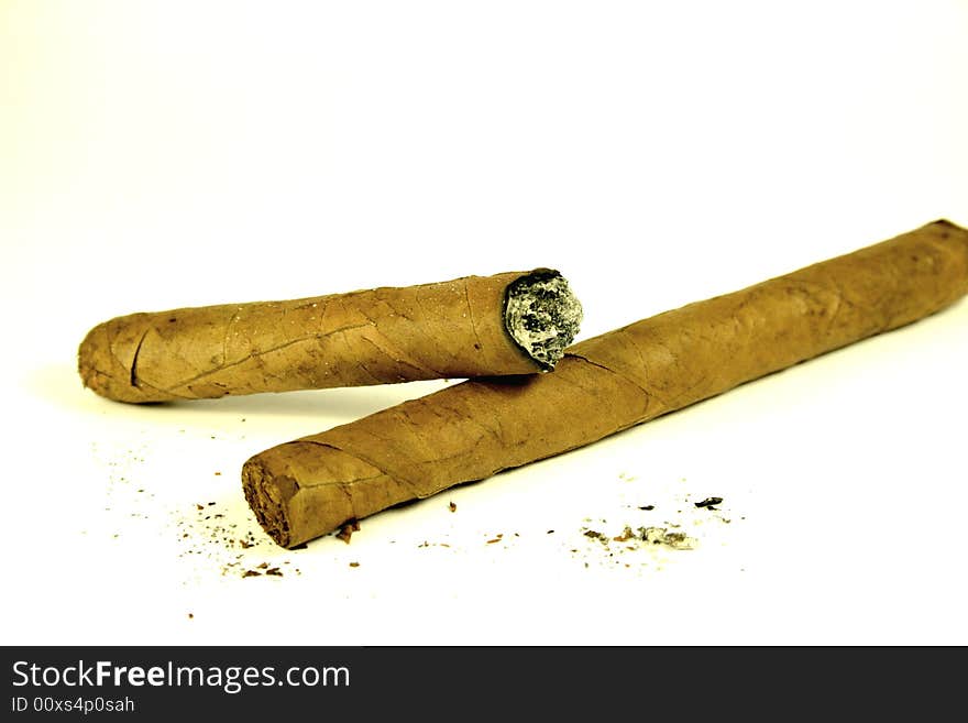 Cigars and ashes on white background. Cigars and ashes on white background