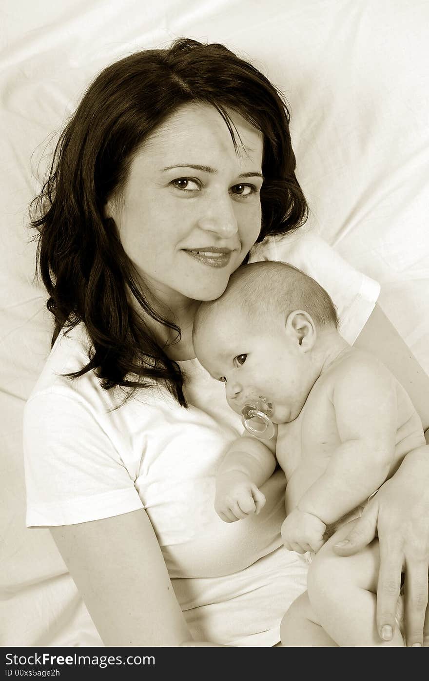 Mom and little baby girl over white background