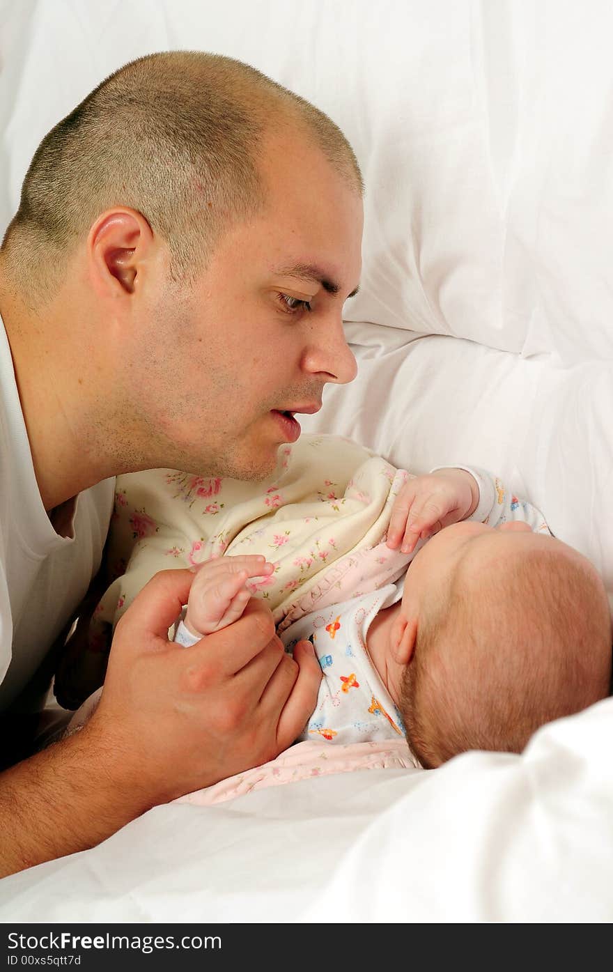 Dad and little baby girl over white background