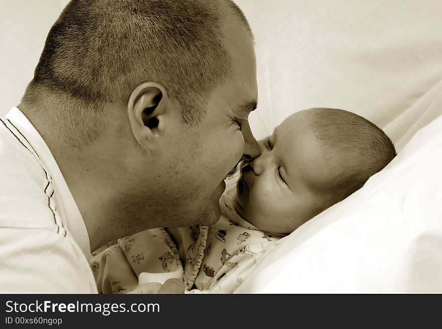 Dad and little baby girl over white background