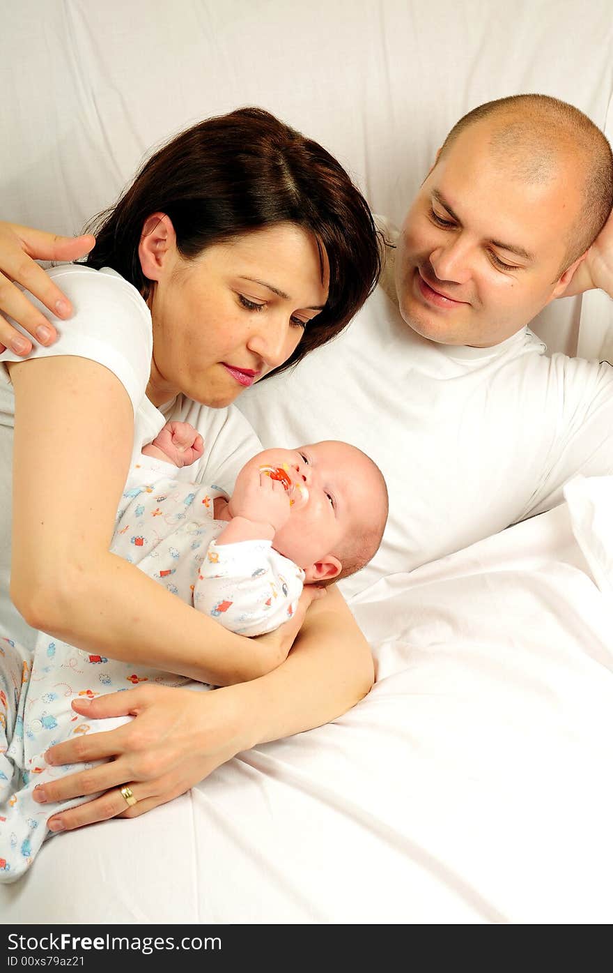 Happy family mother, dad and baby