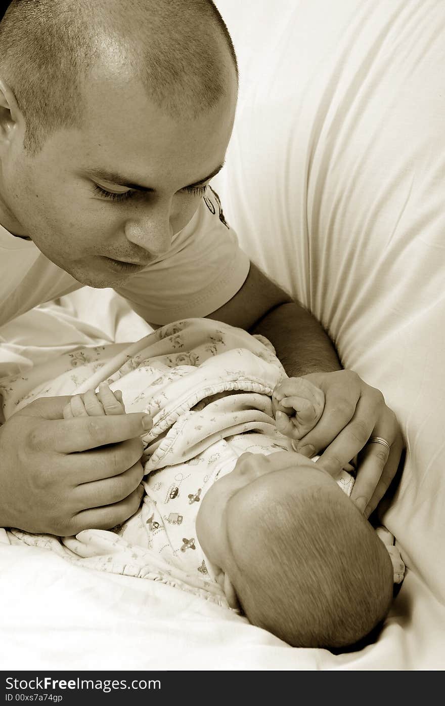 Dad and little baby girl over white background