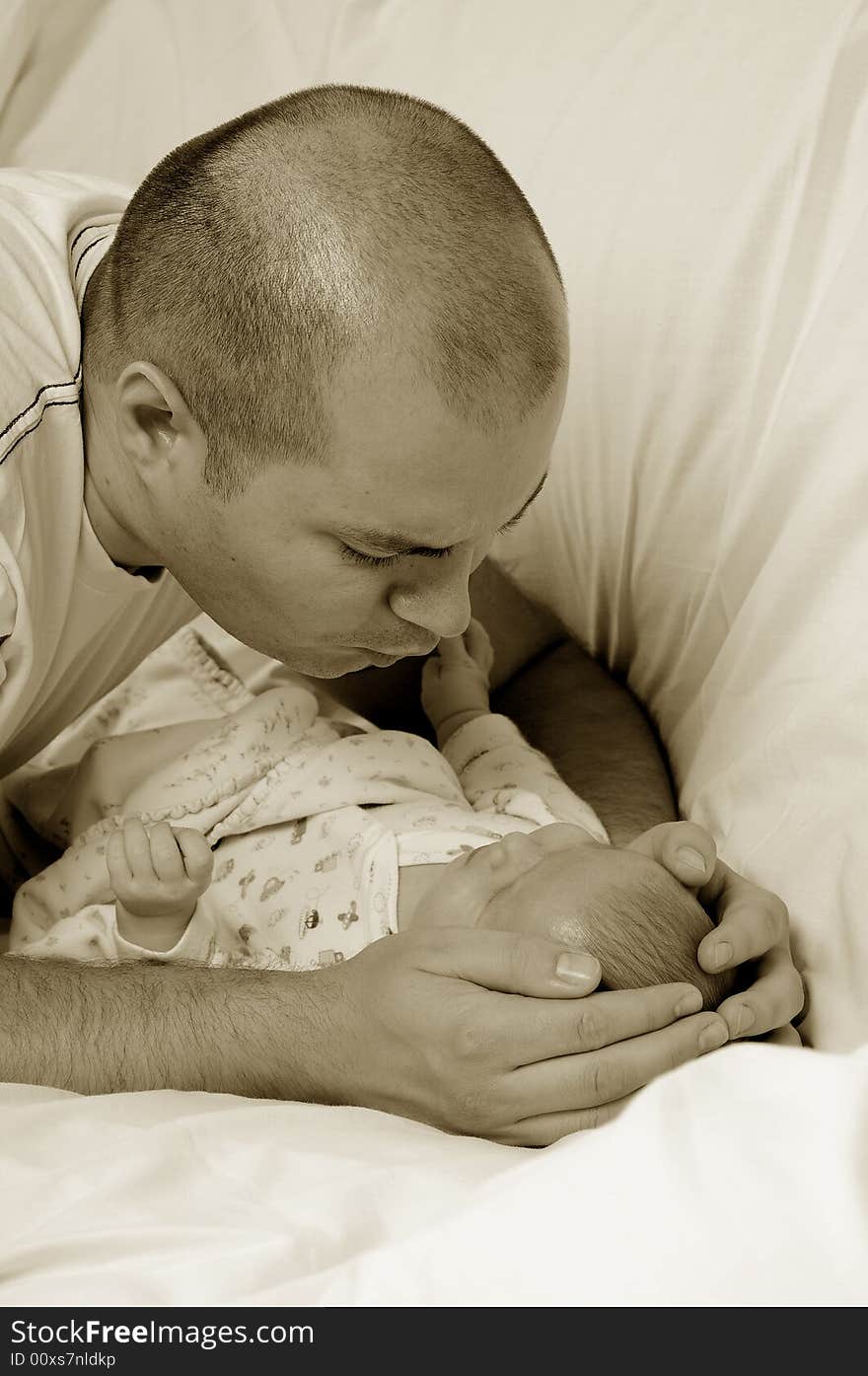 Dad and little baby girl over white background