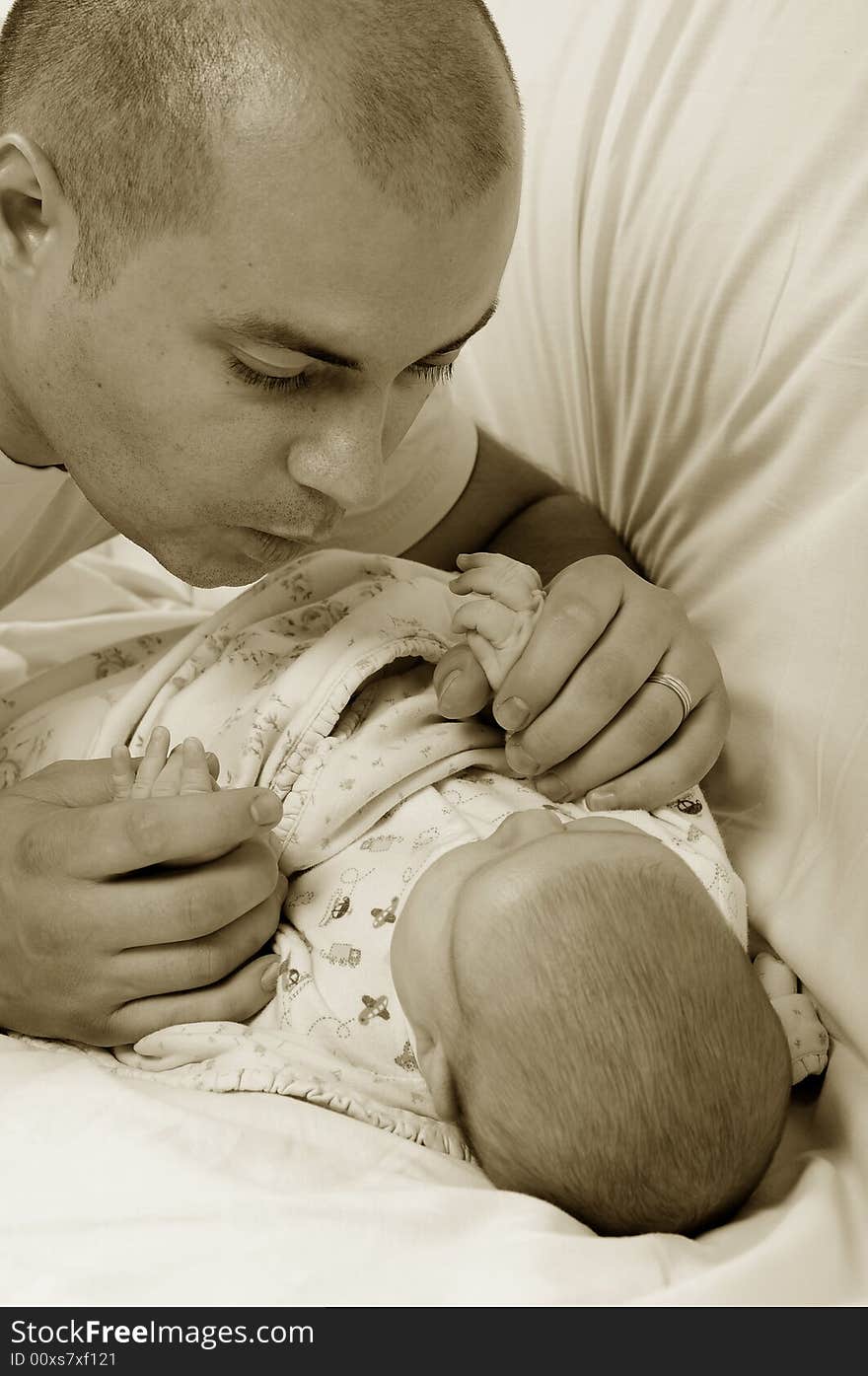 Dad and little baby girl over white background