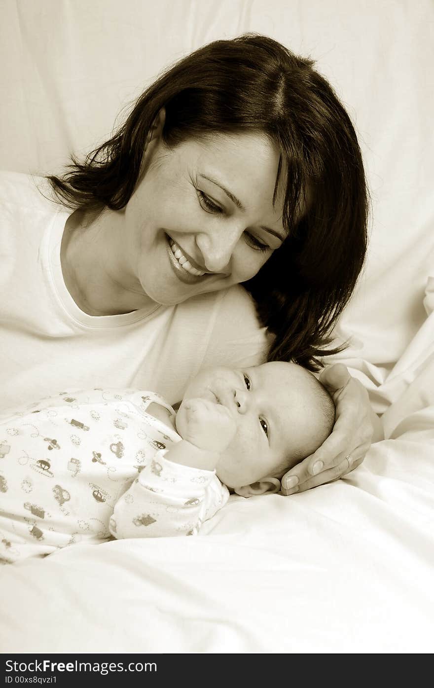 Mom and little baby girl over white background