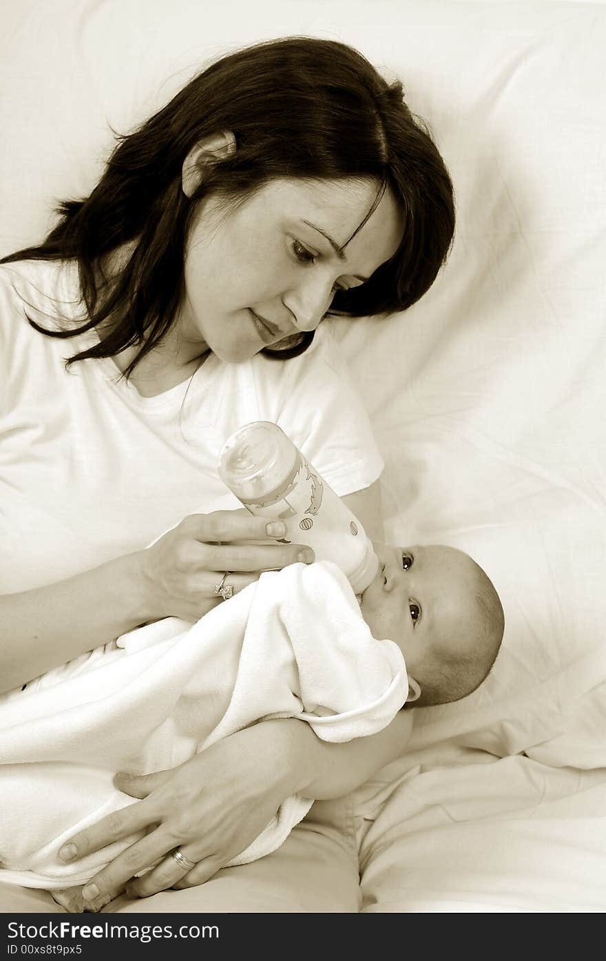 Mom and little baby girl over white background