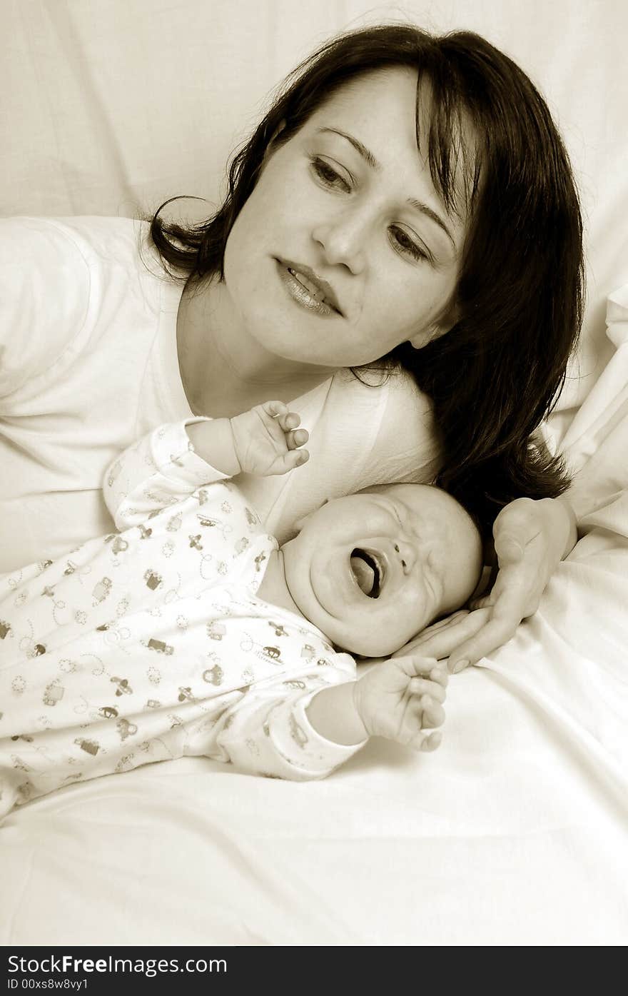 Mom and little baby girl over white background