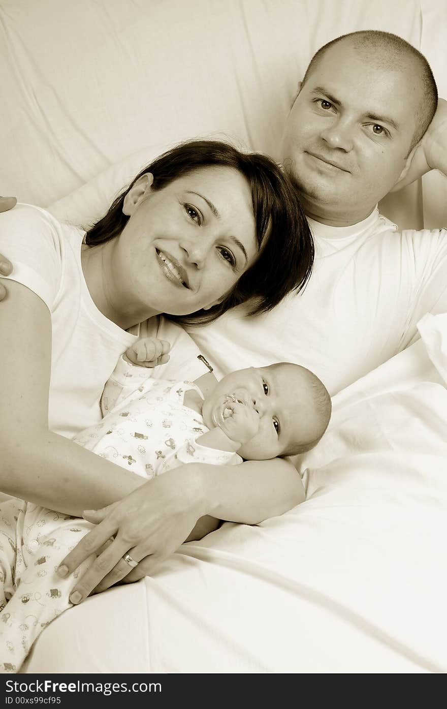 Happy family mother, dad and baby