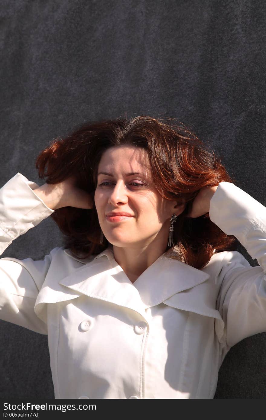 The happy woman, against a grey background. The happy woman, against a grey background.