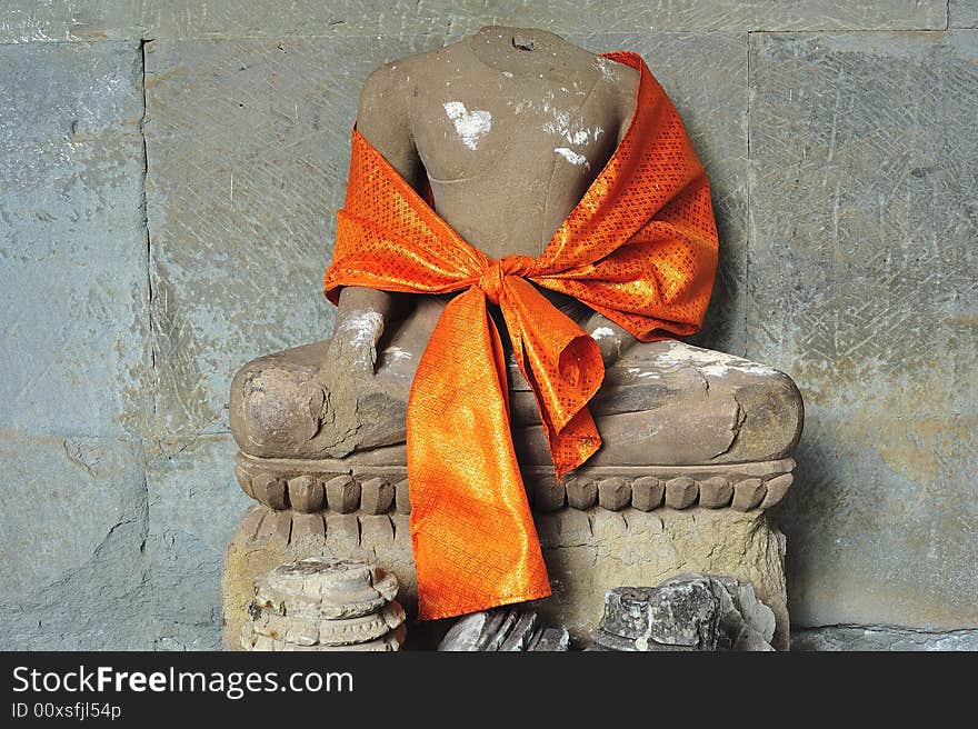 Angkor Wat is probably the biggest and the most famous temple in the world constructed in the 12th century by the king Suryavarman II. here a seated buddha inside the temple. Angkor Wat is probably the biggest and the most famous temple in the world constructed in the 12th century by the king Suryavarman II. here a seated buddha inside the temple