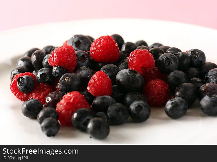 Fresh raspberrys and blueberrys in studio. Fresh raspberrys and blueberrys in studio.