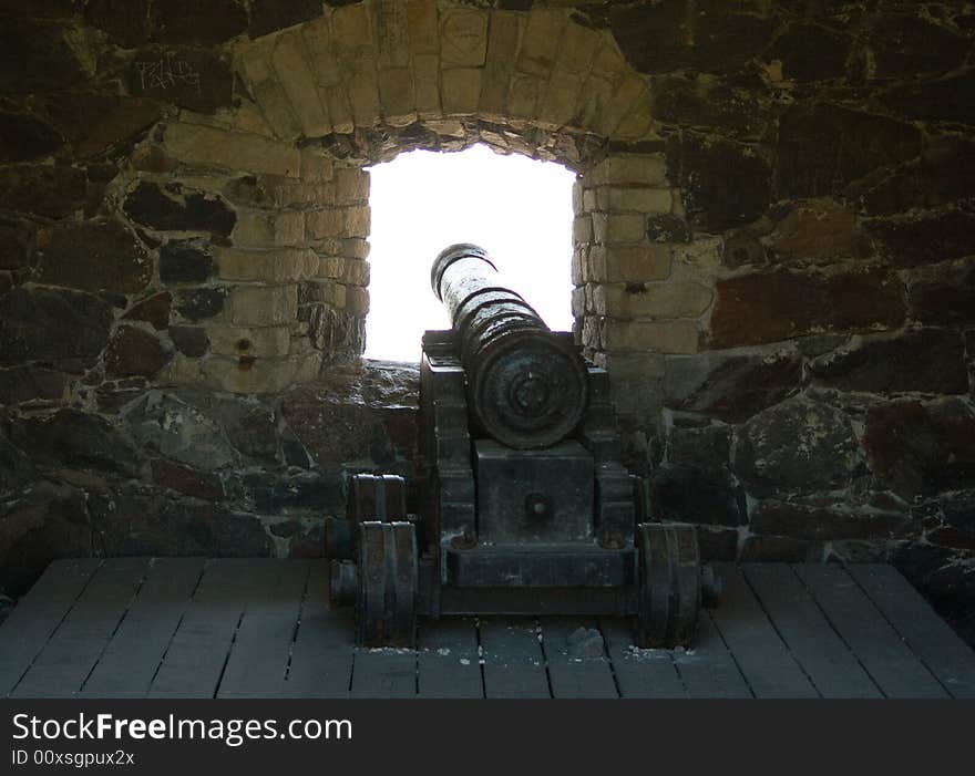 Old cannon in front of the window