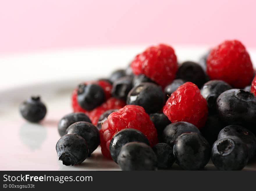 Fresh raspberrys and blueberrys in studio. Fresh raspberrys and blueberrys in studio.