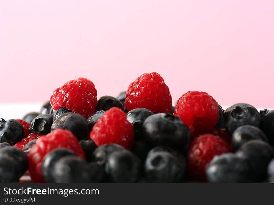 Fresh raspberrys and blueberrys in studio. Fresh raspberrys and blueberrys in studio.