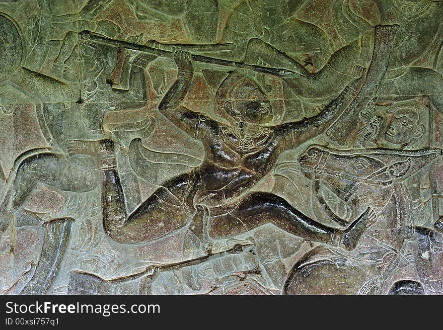 Angkor Wat is probably the biggest and the most famous temple in the world constructed in the 12th century by the king Suryavarman II. The 800 meters of the outsider walls are carved with fantastic scenes; here a scene of infantry fight. Angkor Wat is probably the biggest and the most famous temple in the world constructed in the 12th century by the king Suryavarman II. The 800 meters of the outsider walls are carved with fantastic scenes; here a scene of infantry fight