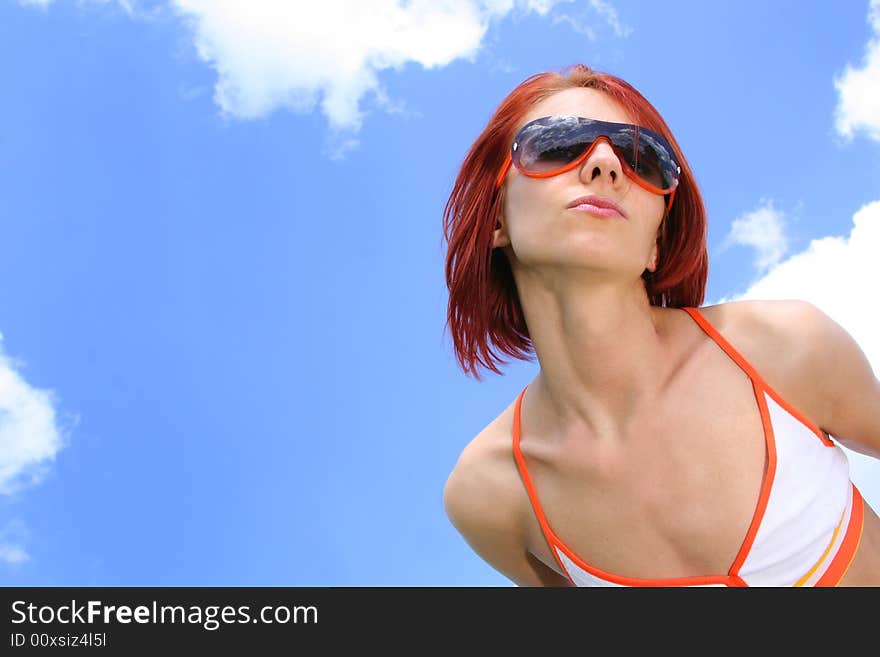 Young redhead girl relaxing outdoors. Young redhead girl relaxing outdoors