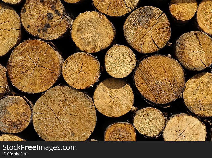 Woodstack background of big stacked logs