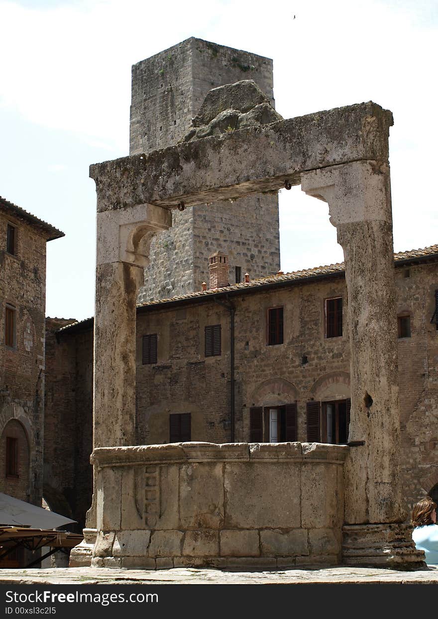 The ancient amd famous cistern in the foremost square in S. Gimignano - Siena. The ancient amd famous cistern in the foremost square in S. Gimignano - Siena