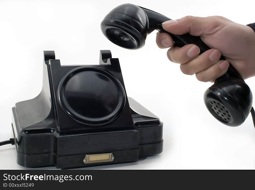 Telephone receiver in hand, isolated on white background. Telephone receiver in hand, isolated on white background.