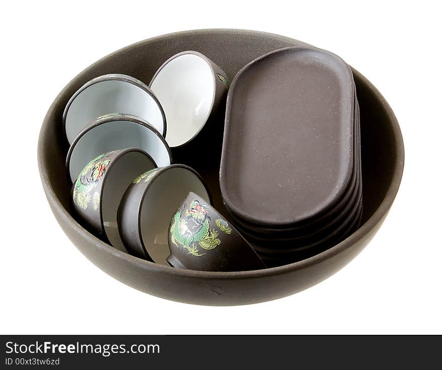 Isolated black teapot and the cups against a white background. Isolated black teapot and the cups against a white background