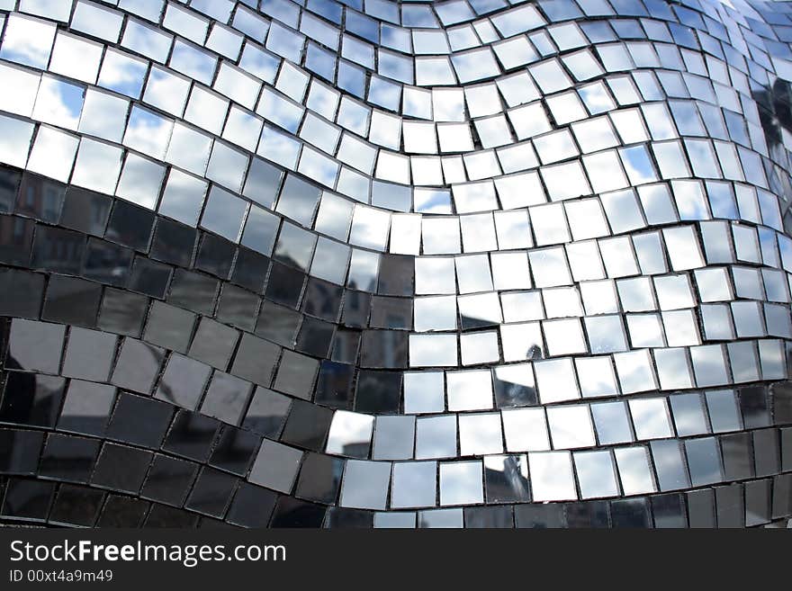 Mosaïc made of little squares of mirrors reflecting the sky. Mosaïc made of little squares of mirrors reflecting the sky.