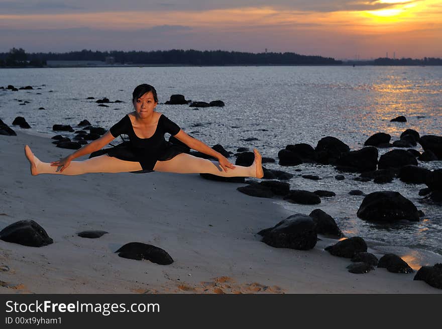 Ballerina doing a jump by the sunset. Ballerina doing a jump by the sunset