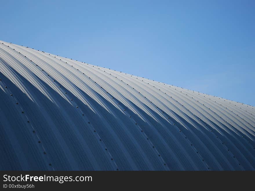 Farming quonset steel angled blue sky