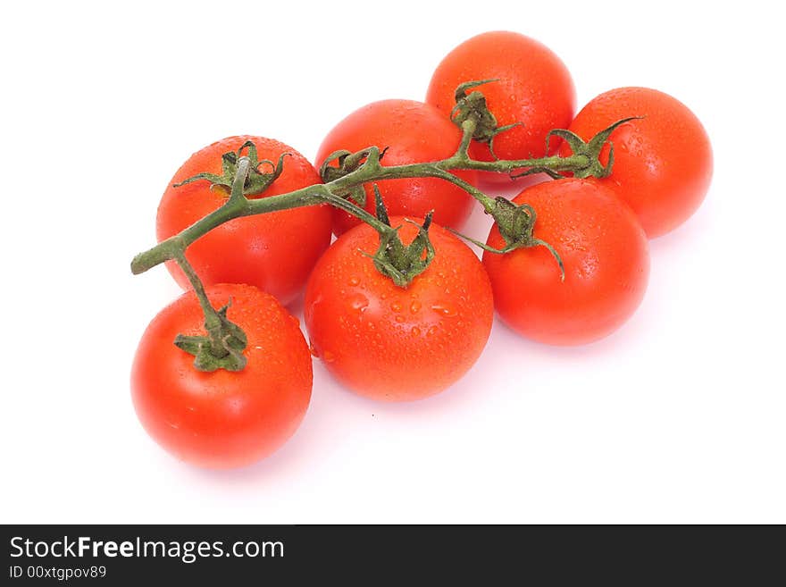 Seven tomatoes with drops