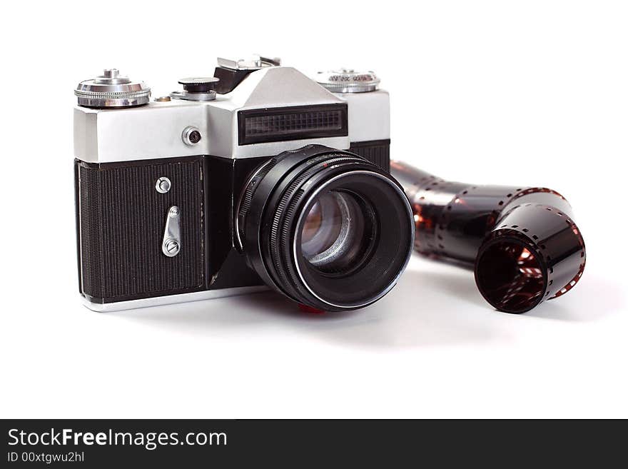 The old analog camera with an objective and a film