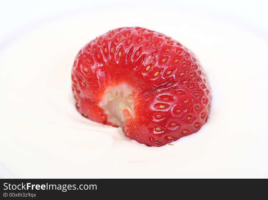 Ripe strawberry with sour cream