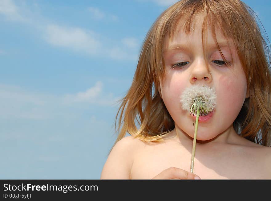 Blowing a dandelion