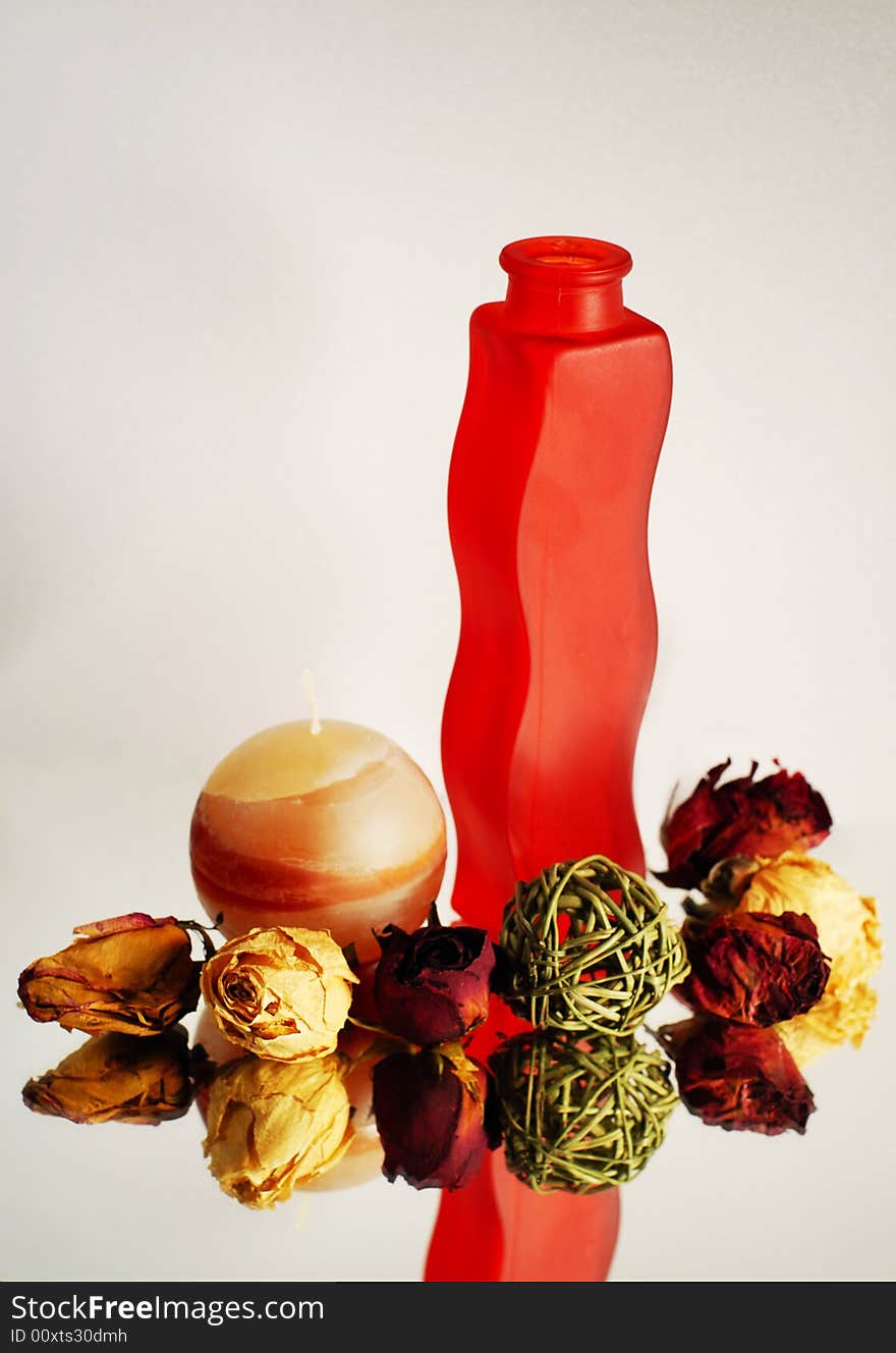 Still-life with vase, candle and red roses. Still-life with vase, candle and red roses