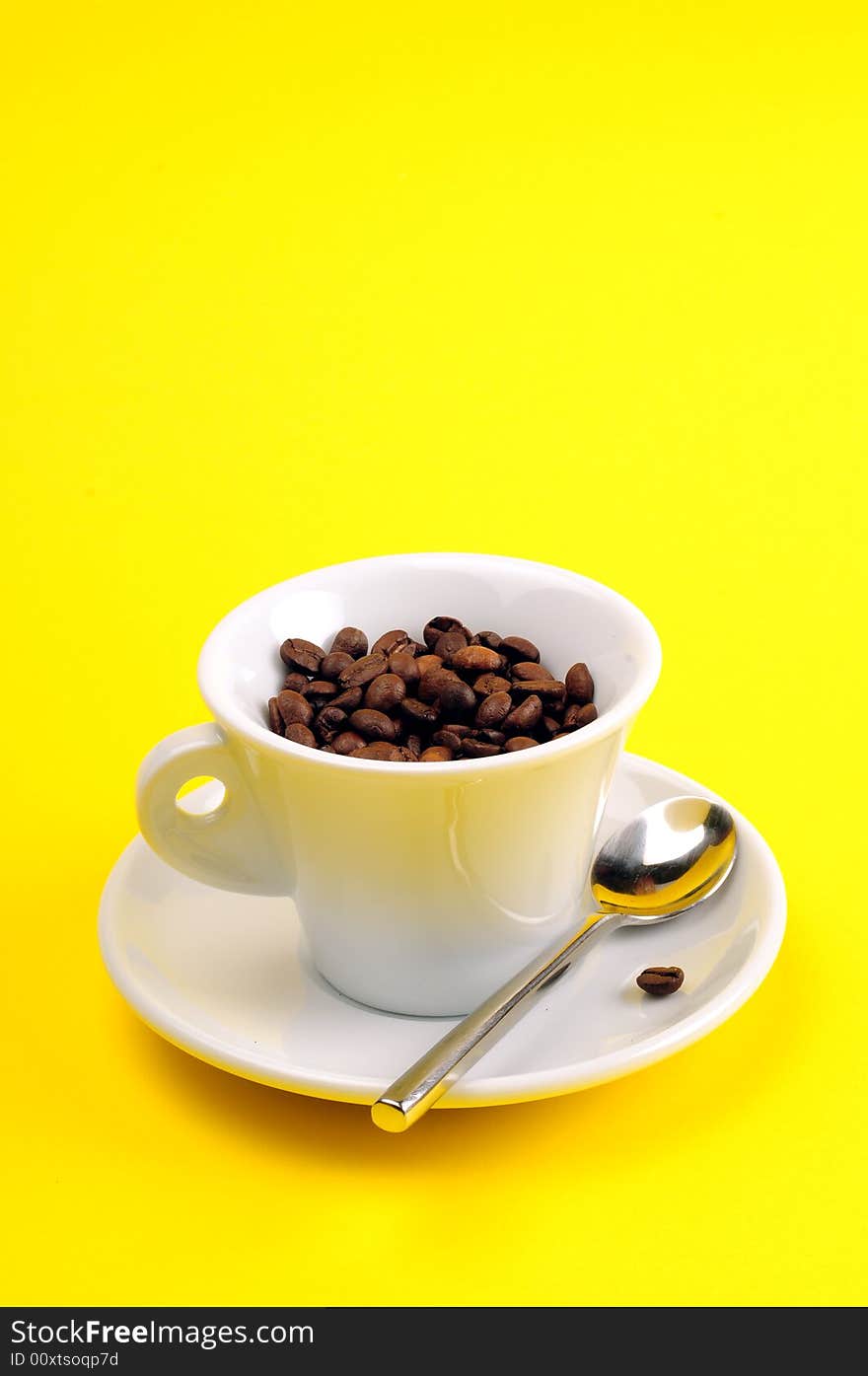 Macro studio shot of a cup of coffee beans.