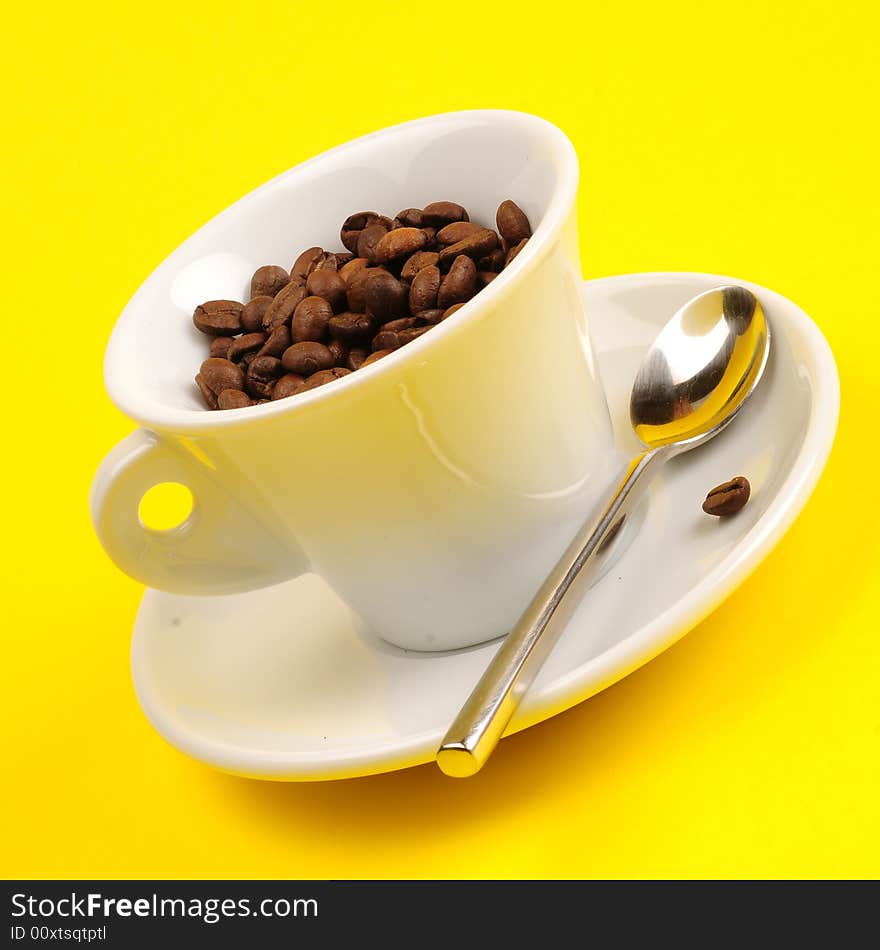 Macro studio shot of a cup of coffee beans.