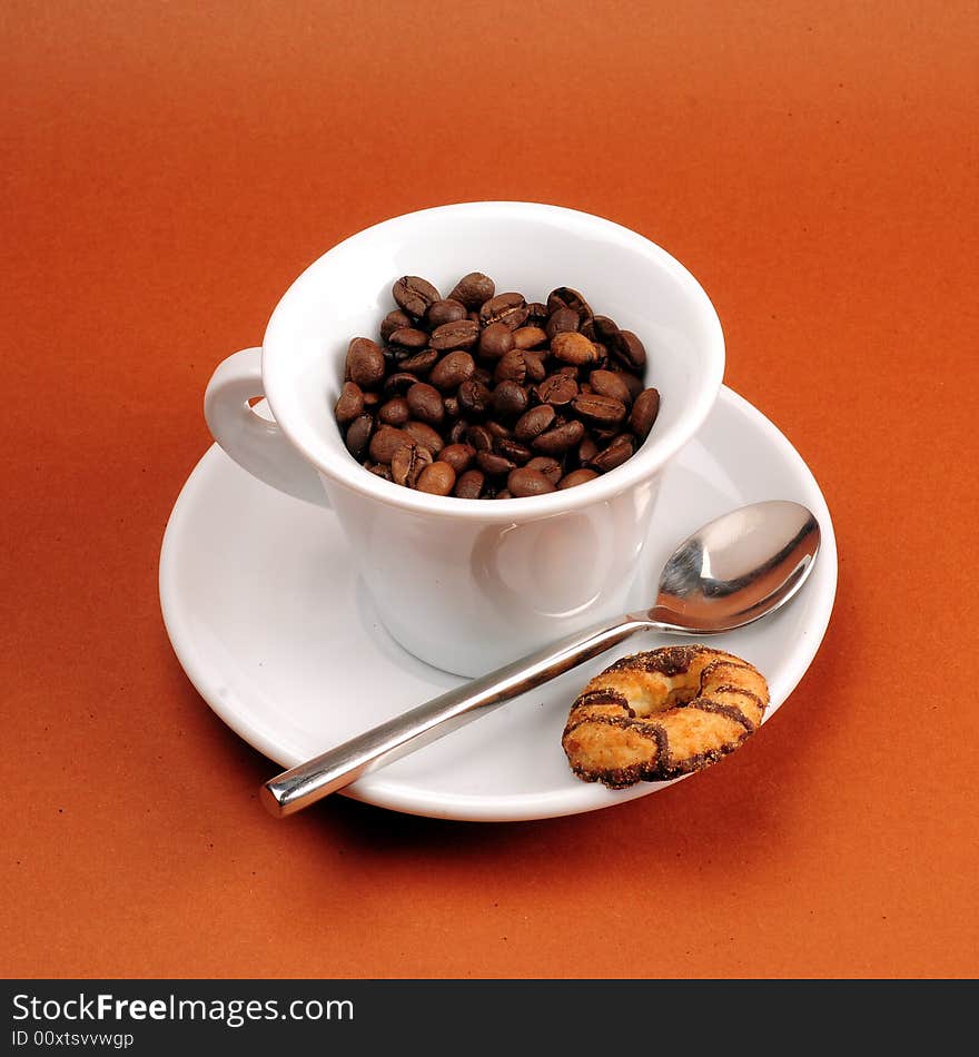 Macro studio shot of a cup of coffee beans.