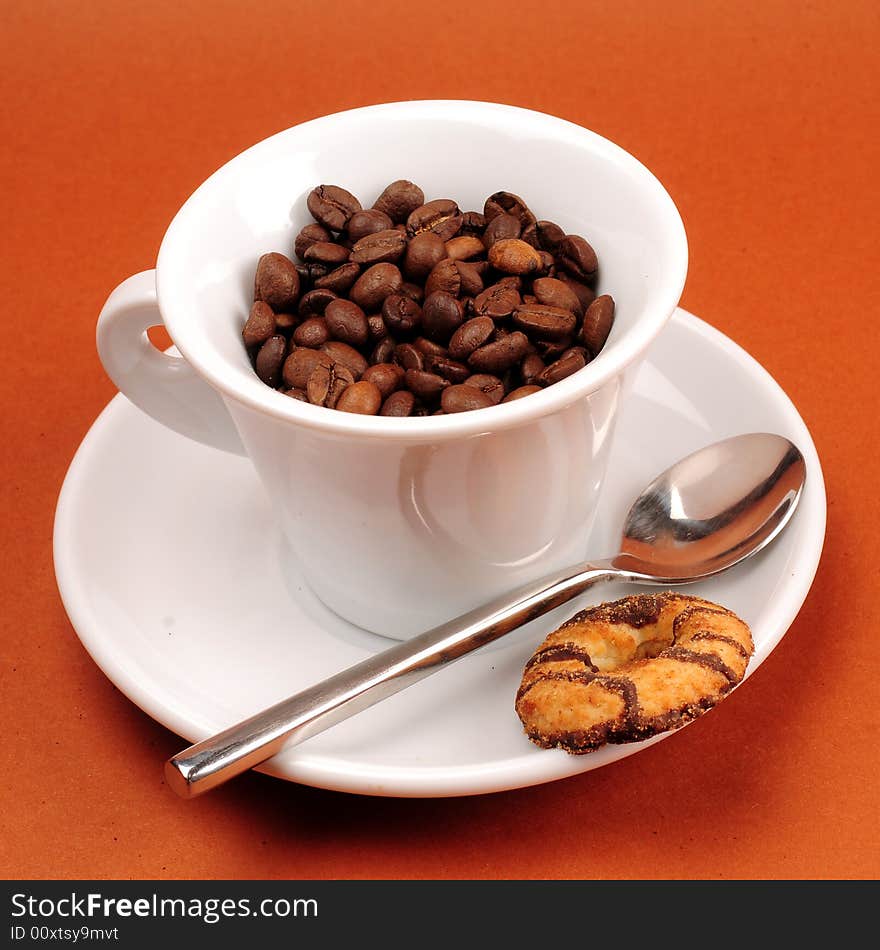 Macro studio shot of a cup of coffee beans.