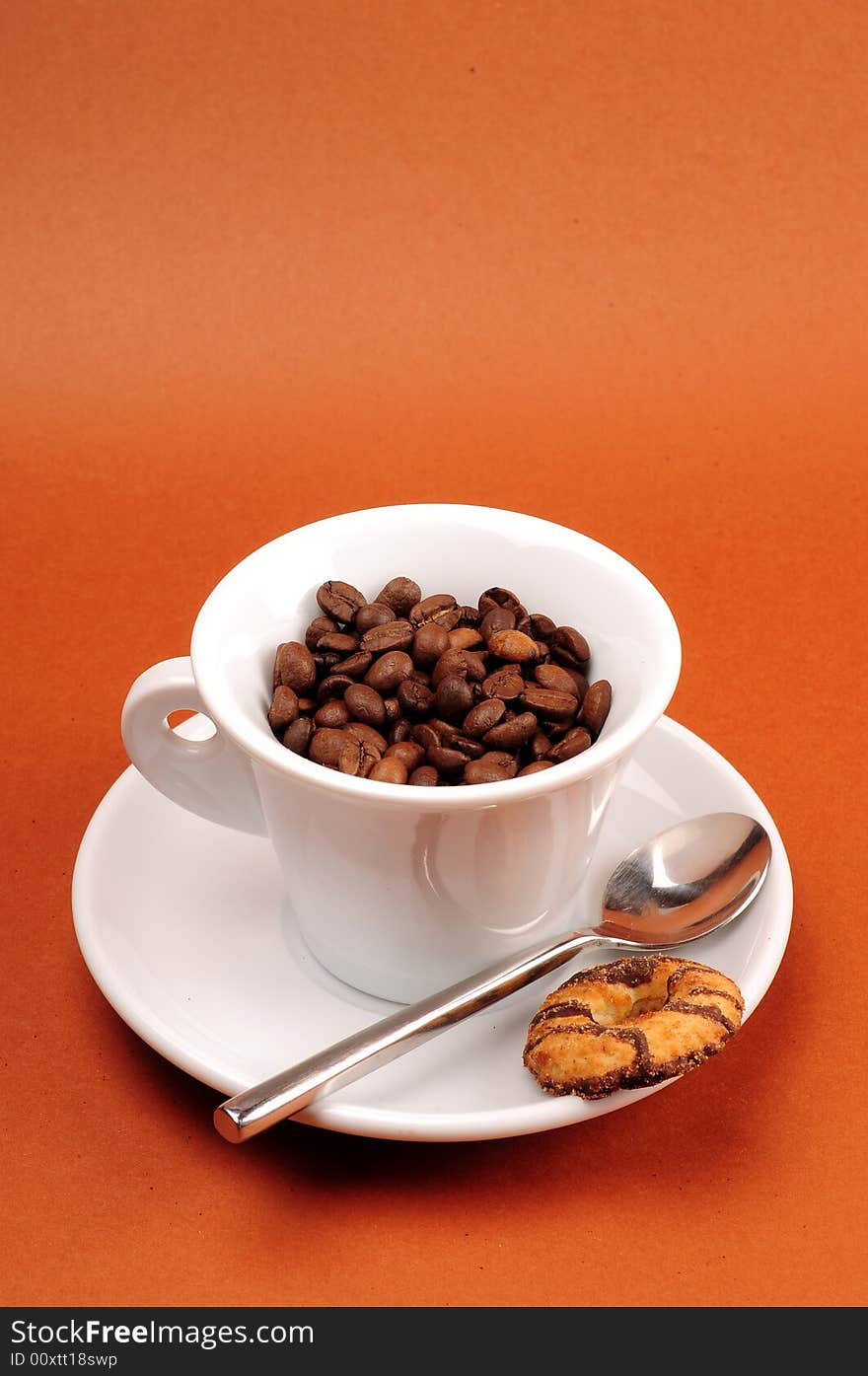 Macro studio shot of a cup of coffee beans.