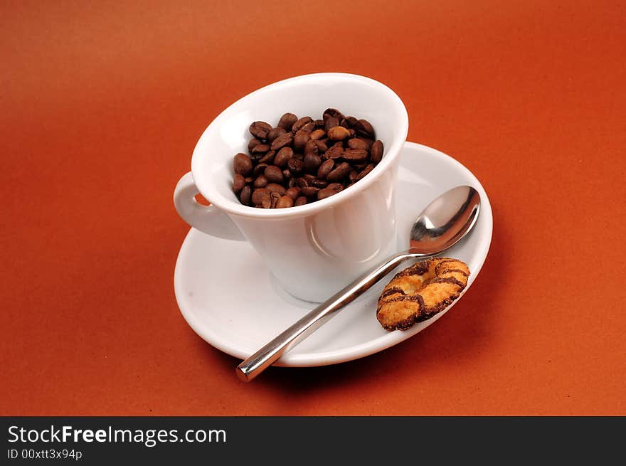 Macro studio shot of a cup of coffee beans.