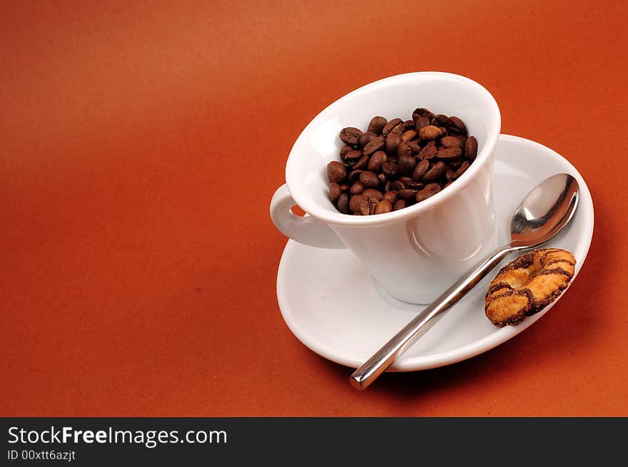 Macro studio shot of a cup of coffee beans.