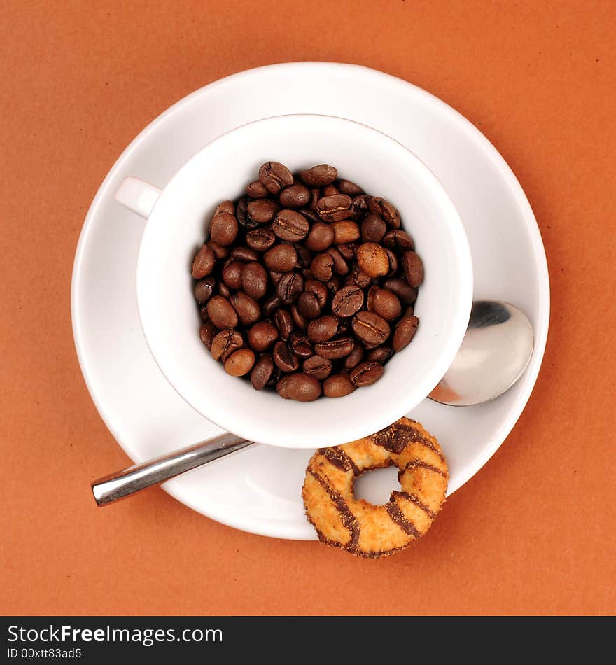 Macro studio shot of a cup of coffee beans.