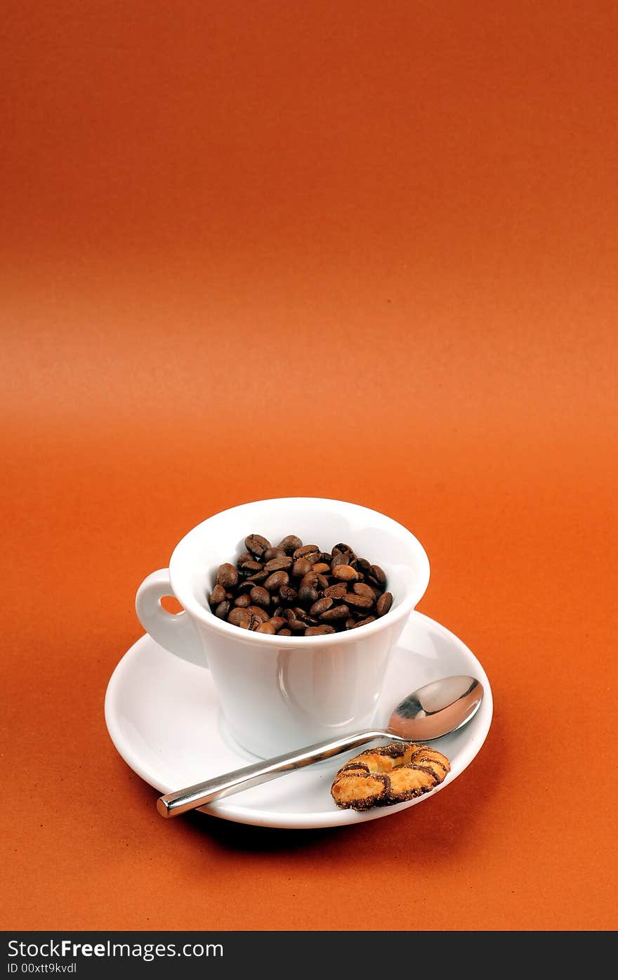 Macro studio shot of a cup of coffee beans.