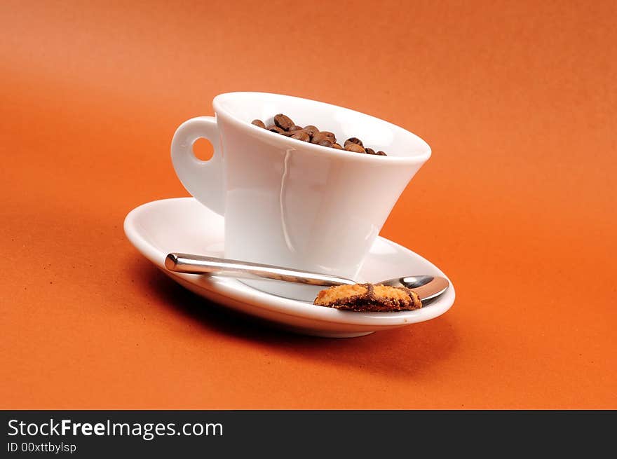 Macro studio shot of a cup of coffee beans.