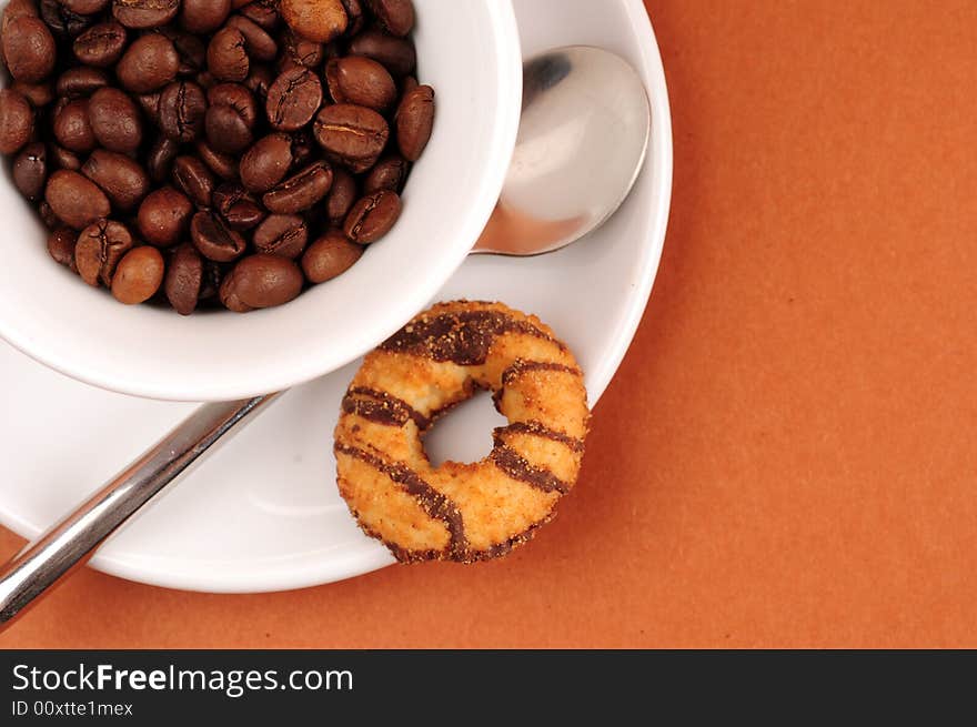 Macro studio shot of a cup of coffee beans.