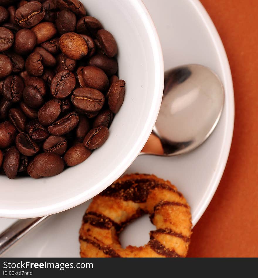 Macro studio shot of a cup of coffee beans.