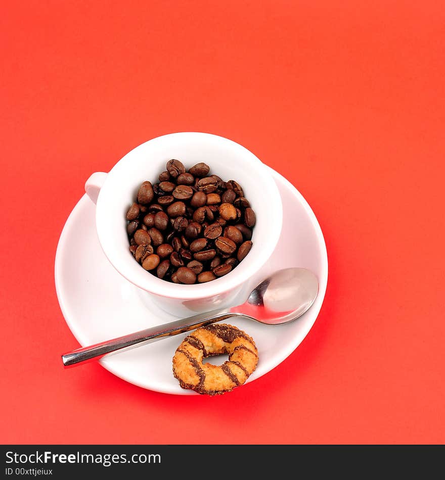 Macro studio shot of a cup of coffee beans.